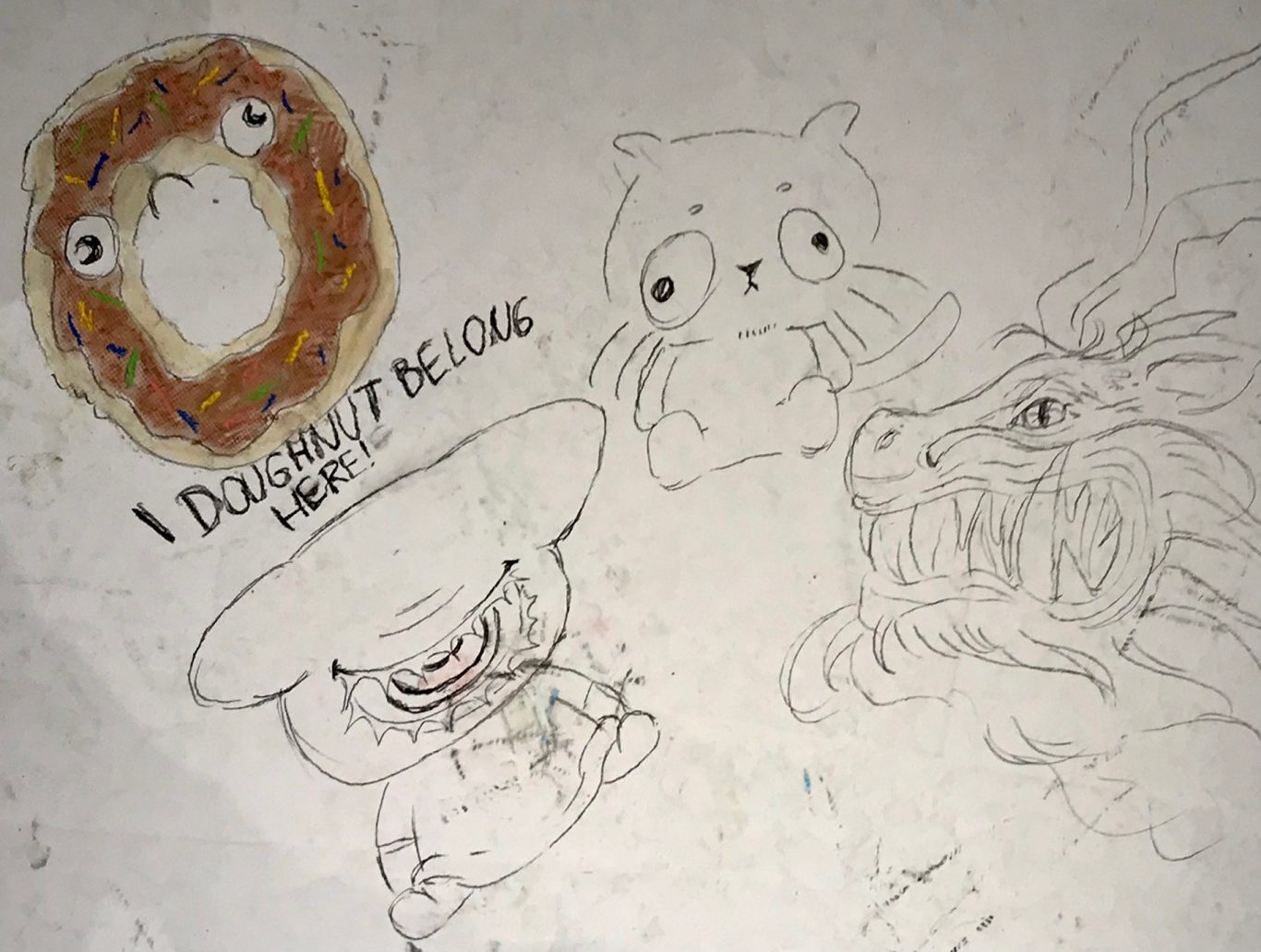 Bunt illustrierte Figuren auf einer Wand mit einem Donut und dem Text "I don't belong here".
